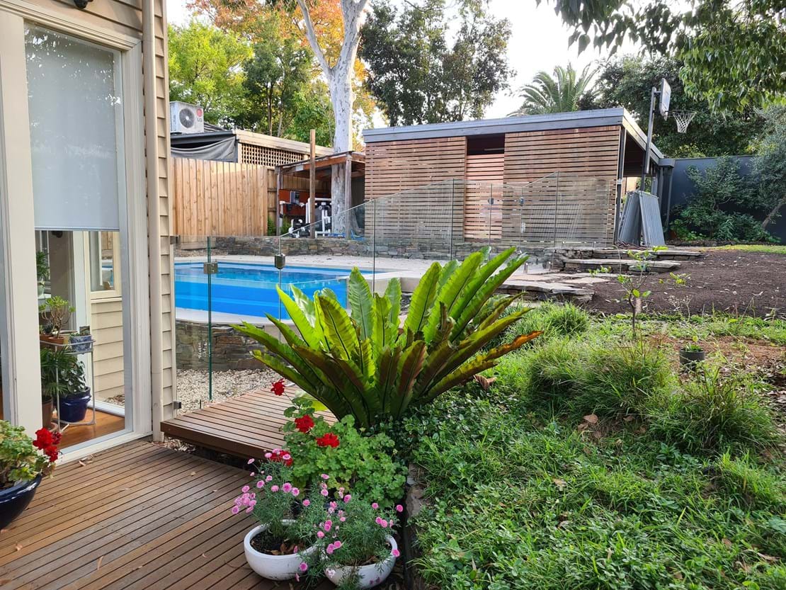Camberwell install Frameless fence with custom panels along deck area Side mounted spiggots on tiled wall