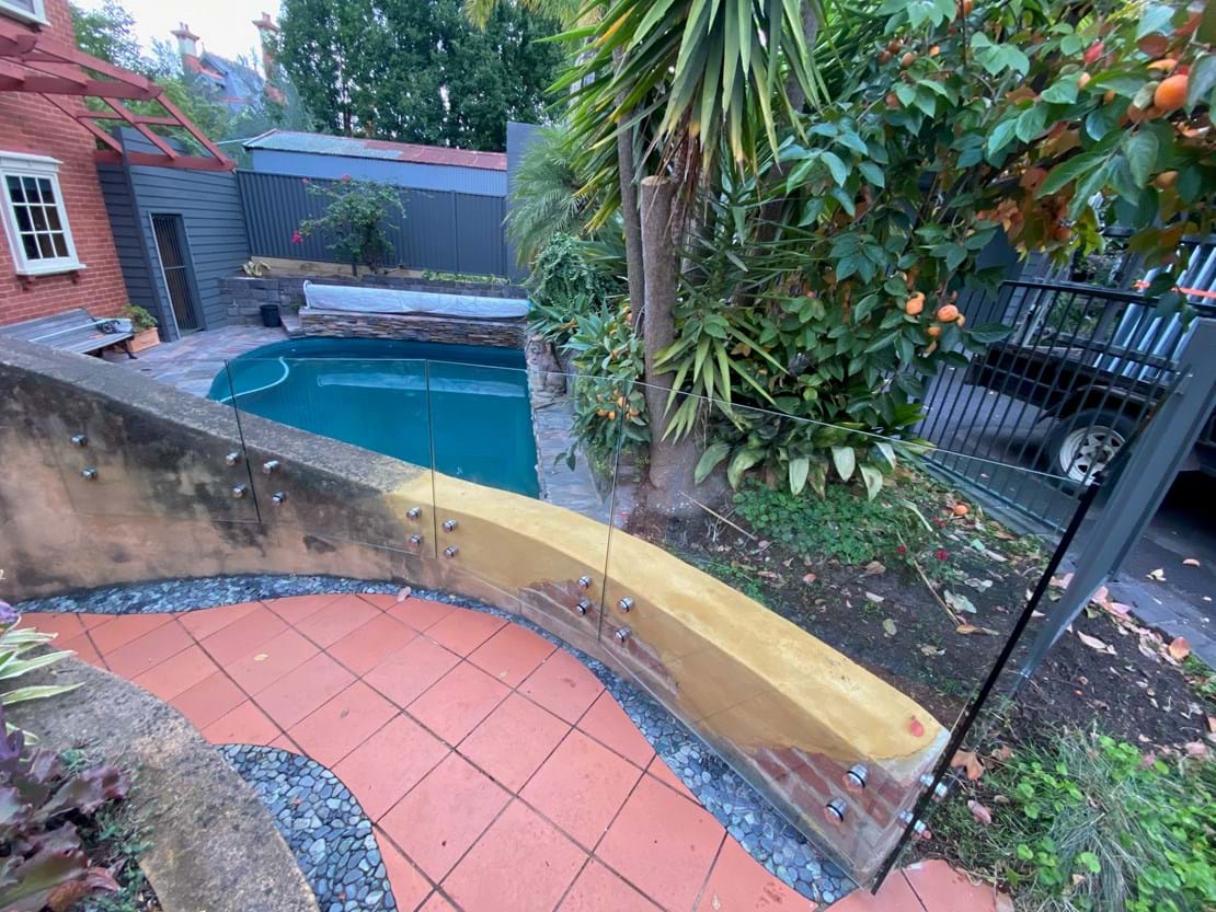 Combination - Standoff Panels on a curved wall with Woodland Grey Aluminium Fence
