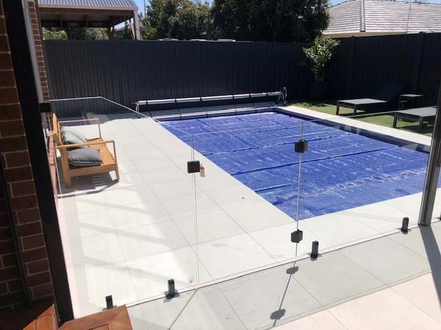 Frameless Glass Fence with Black Spigots
