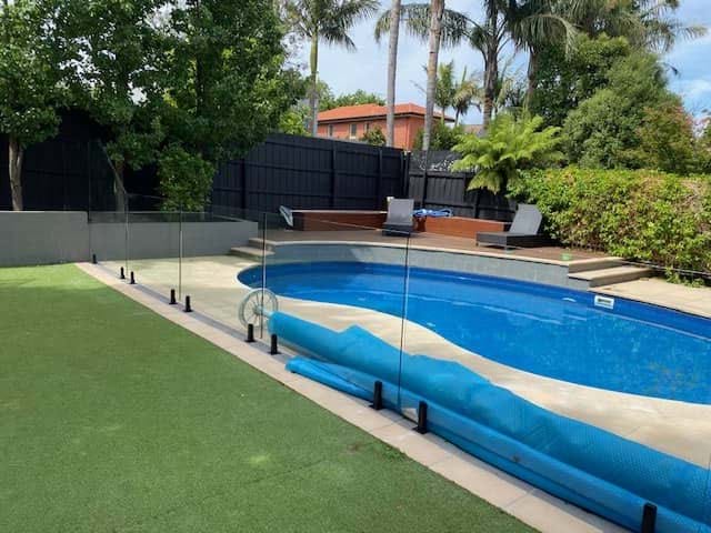 OKE Pool & Spa Frameless Fencing Frameless fencing with core drilled spigots with matt black hardware